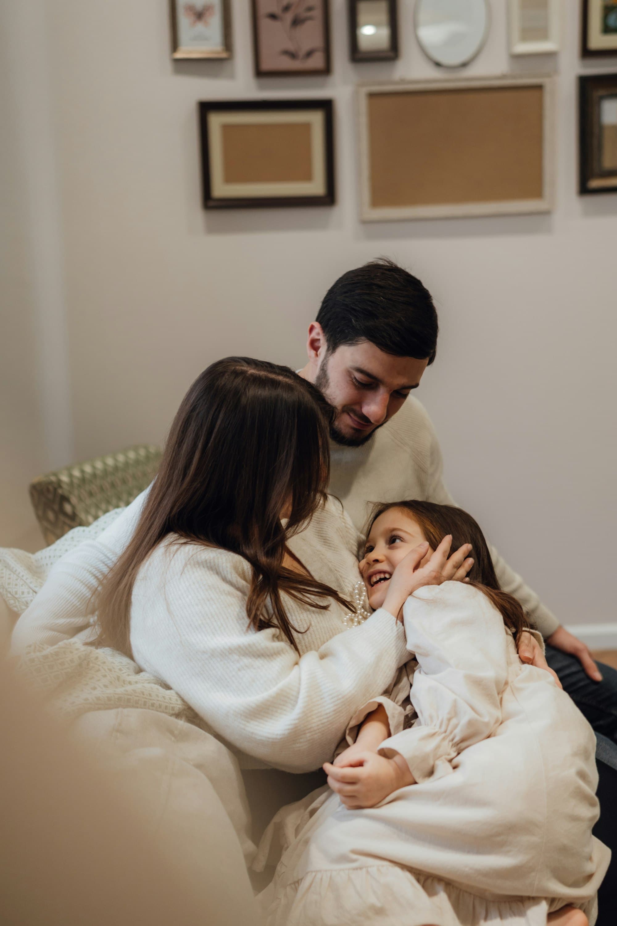 A family sharing a warm embrace at home